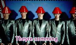 a stamp with a picture of the band devo that says 'they're coming'